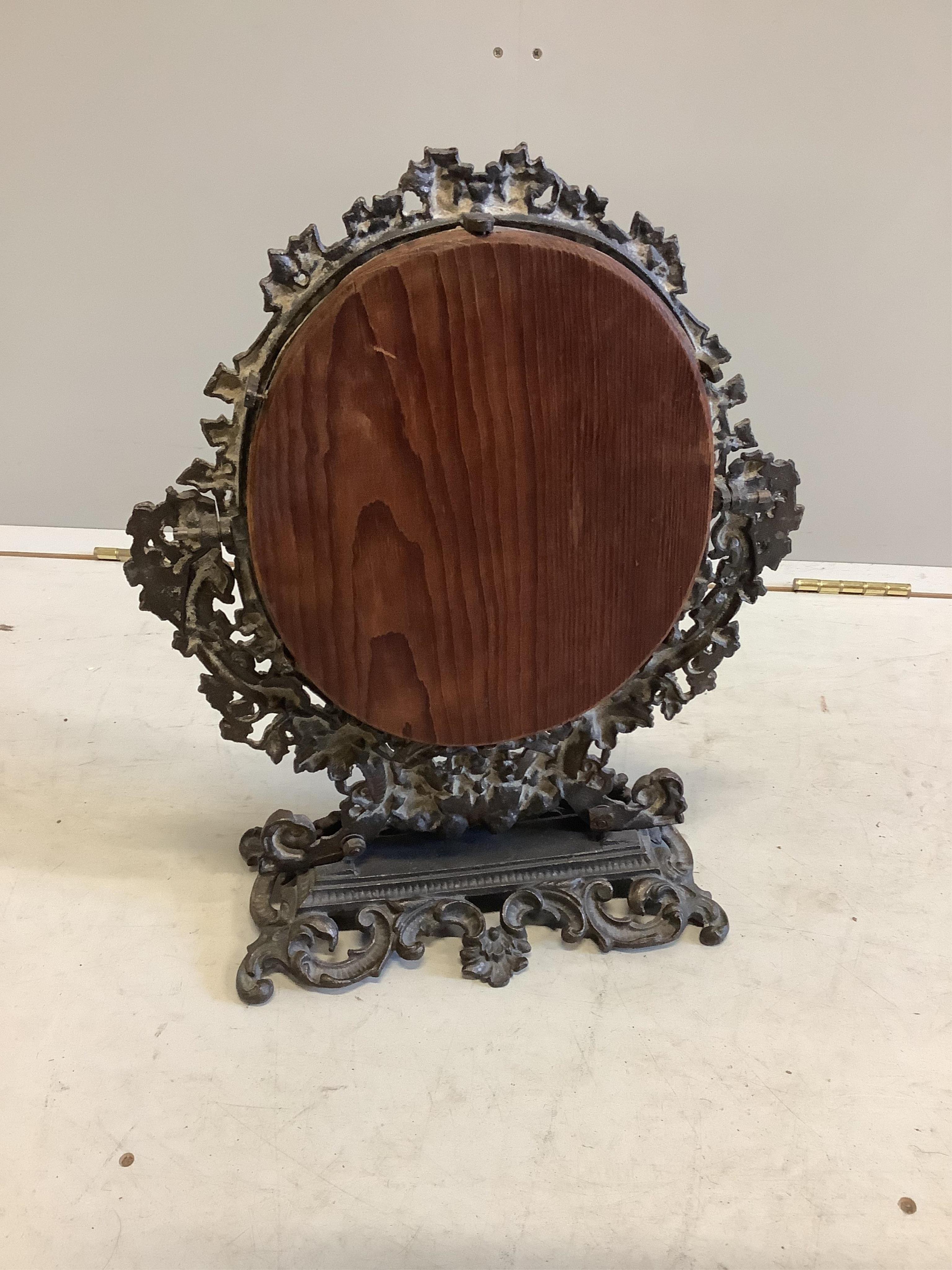 An early 20th century cast iron dressing table mirror, width 38cm, height 49cm. Condition - fair